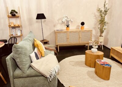 Furnished Apartment in Budapest City Center - Elegant living room with cozy sofa, wooden cabinet, round coffee tables and decorative plants – Astoria Loft Apartment Budapest